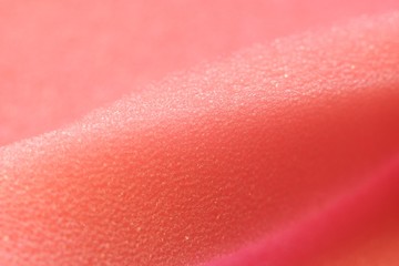 White and Pink artificial foam, foam texture on a light background.