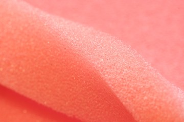 White and Pink artificial foam, foam texture on a light background.