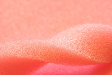 Fototapeta premium White and Pink artificial foam, foam texture on a light background.