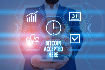 Fototapeta premium Text sign showing Bitcoin Accepted Here. Business photo showcasing you can purchase things through Cryptocurrencies Male human wear formal work suit presenting presentation using smart device