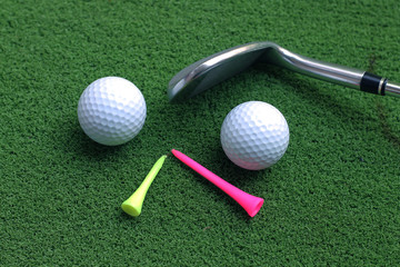 golf ball and club on green grass with copy space for text
