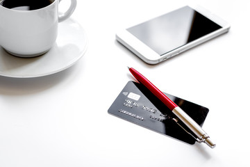 credit card, keyboard, smartphone and coffee cup on white background