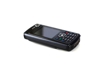 an old black cellphone with white screen at isolated background, ก-ฮ on the keyboard are Thai alphabet.