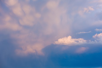Naklejka premium Big and thick clouds on the horizon. Blue sky with thick clouds. Soft focus