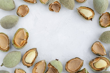Fototapeta na wymiar Fresh young green almonds flat lay