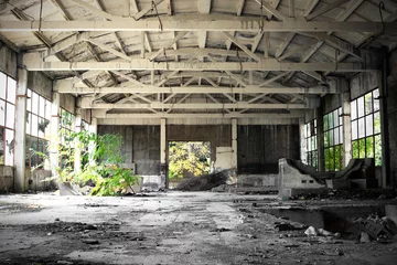 Foto op Plexiglas Abandoned building interior. Partially ruined warehouse building from the Post Soviet era © Azazello