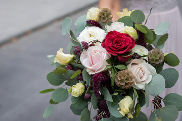 Colourful bouquet and bride