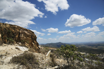 Stone Hill and Blue Sky with White Clouds