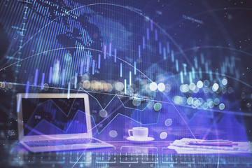 Stock market chart hologram drawn on personal computer background. Double exposure. Concept of investment.