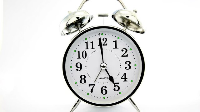 silver alarm clock isolated time lapse 