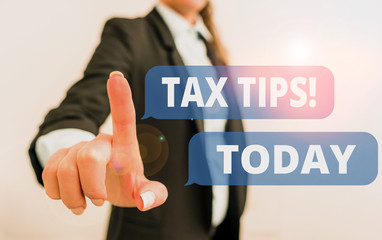 Text sign showing Tax Tips. Business photo text compulsory contribution to state revenue levied by government Digital business in black suite concept with business woman