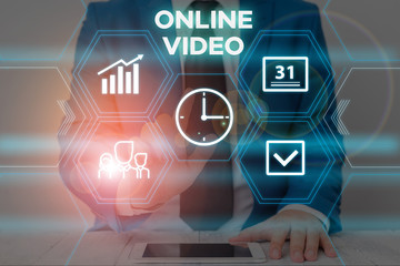 Text sign showing Online Video. Business photo text deals with the transmission of video over the Internet Male human wear formal work suit presenting presentation using smart device