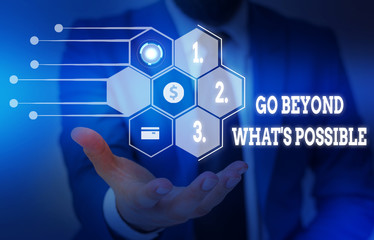 Writing note showing Go Beyond What S Possible. Business concept for do bigger things You can reach dreams Male wear formal suit presenting presentation smart device