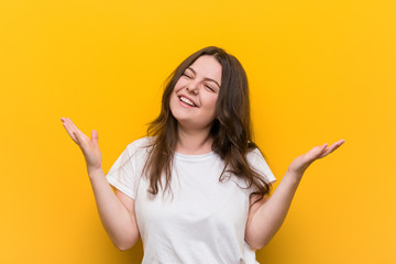 Young curvy plus size woman joyful laughing a lot. Happiness concept.