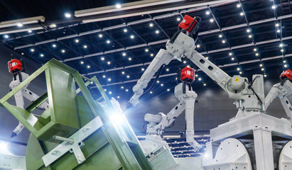 Industrial welding robots in production line manufacturer factory 