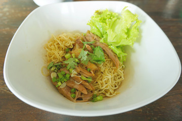 Asian street food, egg noodle with roasted pork