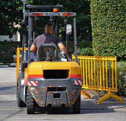 Forklift at work on the city street