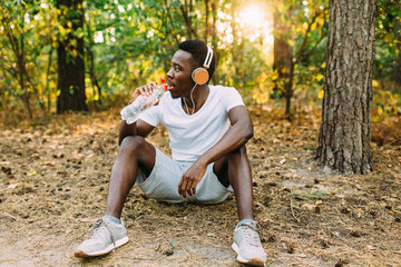 A young athletic African American relaxes after an intense workout