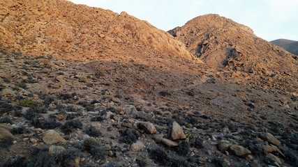 walk through a beautiful landscape with the sunset between the sky and the land
