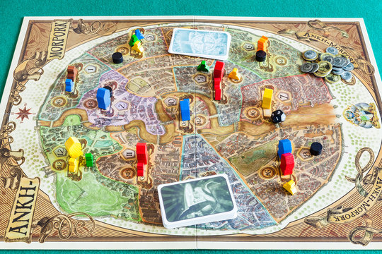 MOSCOW, RUSSIA - APRIL 3, 2019: gameplay of Discworld: Ankh-Morpork board game. This game was designed by Martin Wallace and Treefrog Games, and first published in 2011.