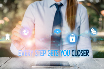 Conceptual hand writing showing Every Step Gets You Closer. Concept meaning Keep moving to reach...