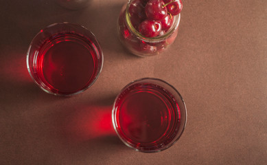 Glass of fresh cherry juice close up