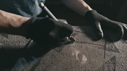 Glass cutting and processing for fireplace doors. Circular glass cutter. Worker cut glass with glass cutting diamond.