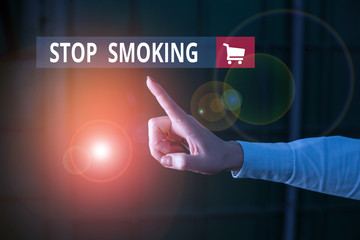 Word writing text Stop Smoking. Business photo showcasing the process of discontinuing or quitting tobacco smoking Finger pointing in the Dark with hand pointing in the copy space