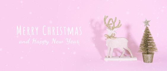 Creative Christmas design on pink pastel color background with Christmas tree.