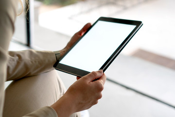 Females hands holding digital tablet