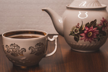 Cup of tea with teapot