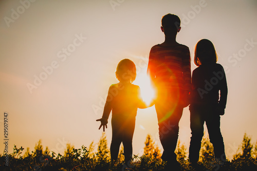 Silhouettes Of Kids Boy And Girls Holding Hands At Sunset Wall Mural Nadezhda1906 Silhouettes Of Kids Boy And Girls Holding Hands At Sunset Wall Mural Nadezhda1906