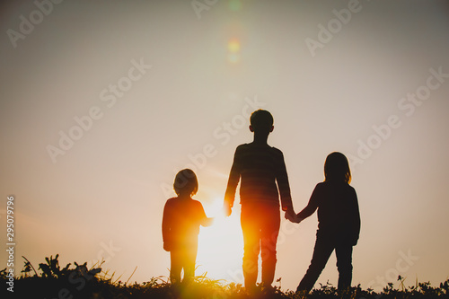 Silhouettes Of Kids Boy And Girls Holding Hands At Sunset Wall Mural Nadezhda1906 Silhouettes Of Kids Boy And Girls Holding Hands At Sunset Wall Mural Nadezhda1906