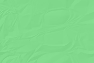crumpled green paper background close up