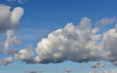 Beautiful flowing clouds in the blue sky on an autumn day.