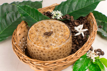 Brazilian dessert made of tapioca pearls called sagu in coffee flavor in a basket with coffee beans