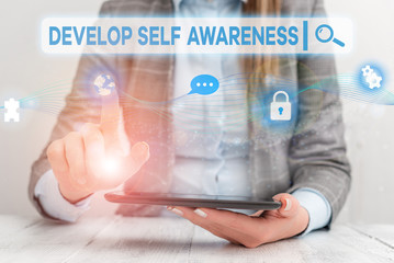 Text sign showing Develop Self Awareness. Business photo showcasing increase conscious knowledge of own character Female human wear formal work suit presenting presentation use smart device