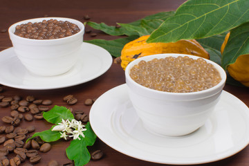 Brazilian dessert made of tapioca pearls called sagu in coffee and chocolate flavors with coffee beand and cocoa in wood background
