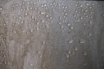 Water drops on metallic wall