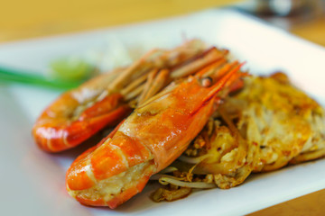 Pad Thai shrimps on a white plate - Thai food