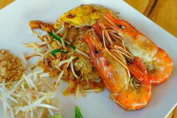 Pad Thai shrimps on a white plate - Thai food