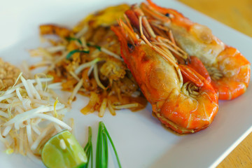 Pad Thai shrimps on a white plate - Thai food