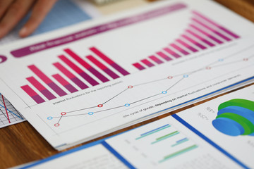 Close-up of biz documents with statistics data in charts, graphs and diagrams. Financial forecast...