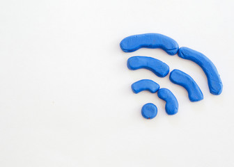 Wifi symbol drawn from modelling clay with copy-space