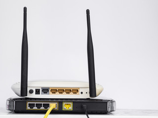 Wireless routers stacked on one another