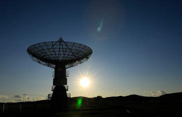 Observatory equipment in the sunset silhouette