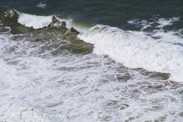 waves crashing on rocks
