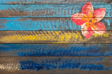 Painting from blue and yellow wooden crates. The upper corner has beautiful flowers in the style of...