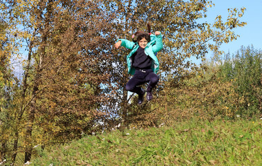 Fototapeta premium Child plays outside on a sunny day