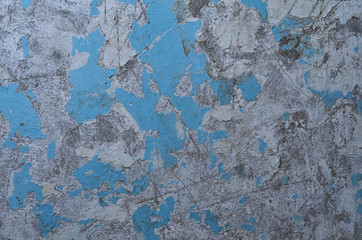 textuur van de oude gehavende muur blauwe afbladderende verf, beton, grijze cement grunge